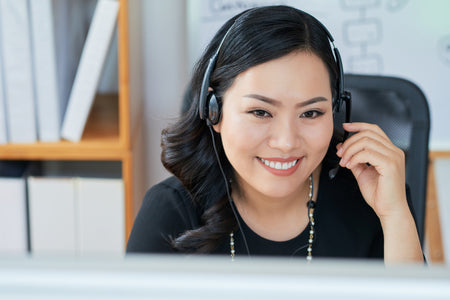 Woman wearing a headset in an office setting